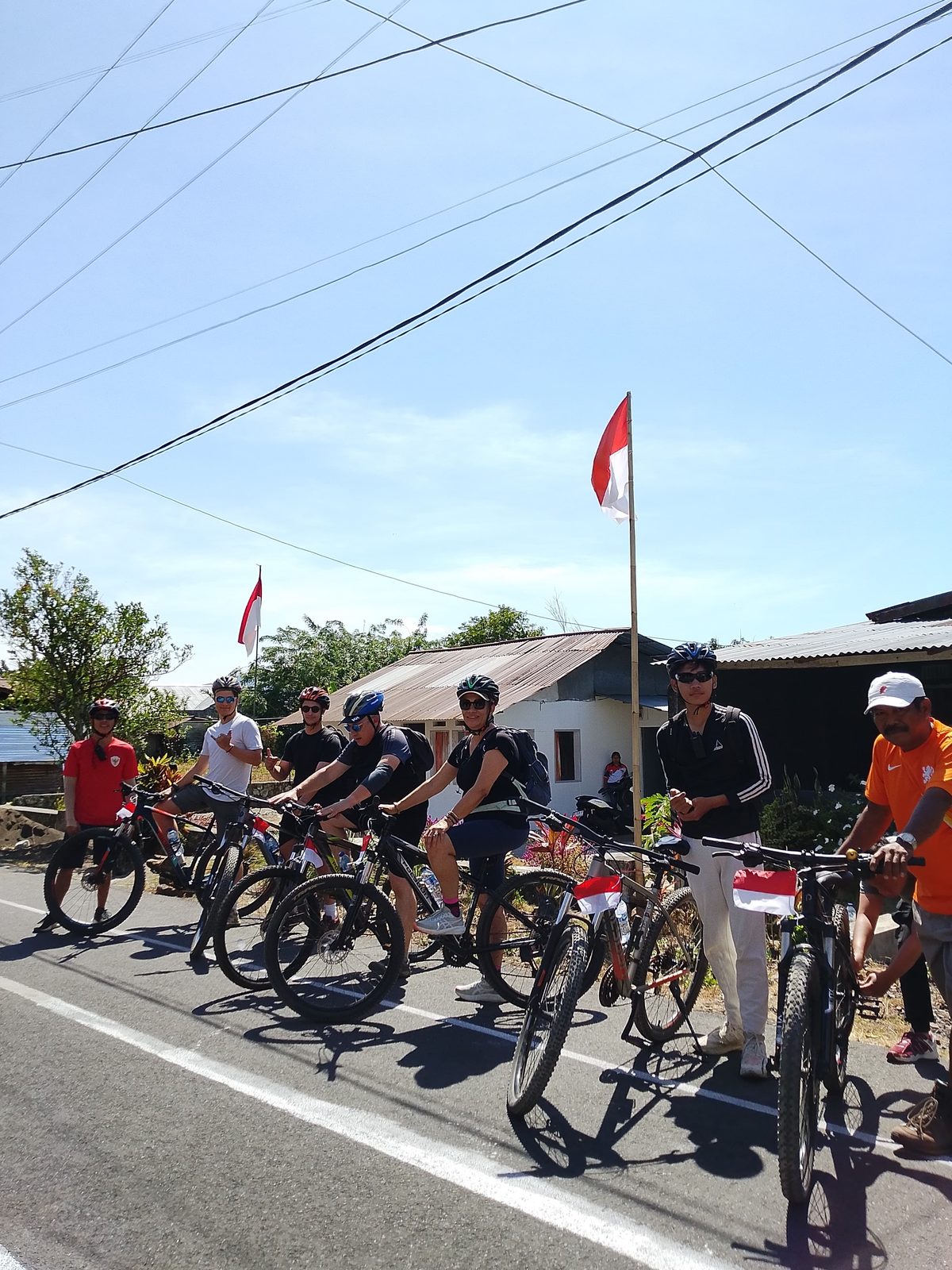 The full group lined up with Indonesian flags before setting off